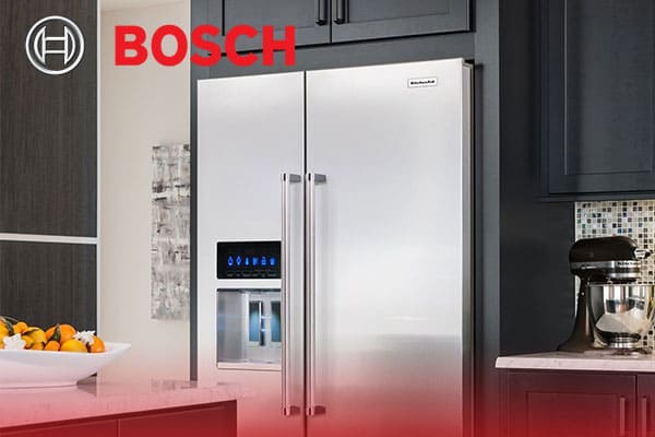 A picture containing text, indoor, kitchen appliance, stainless Description automatically generated